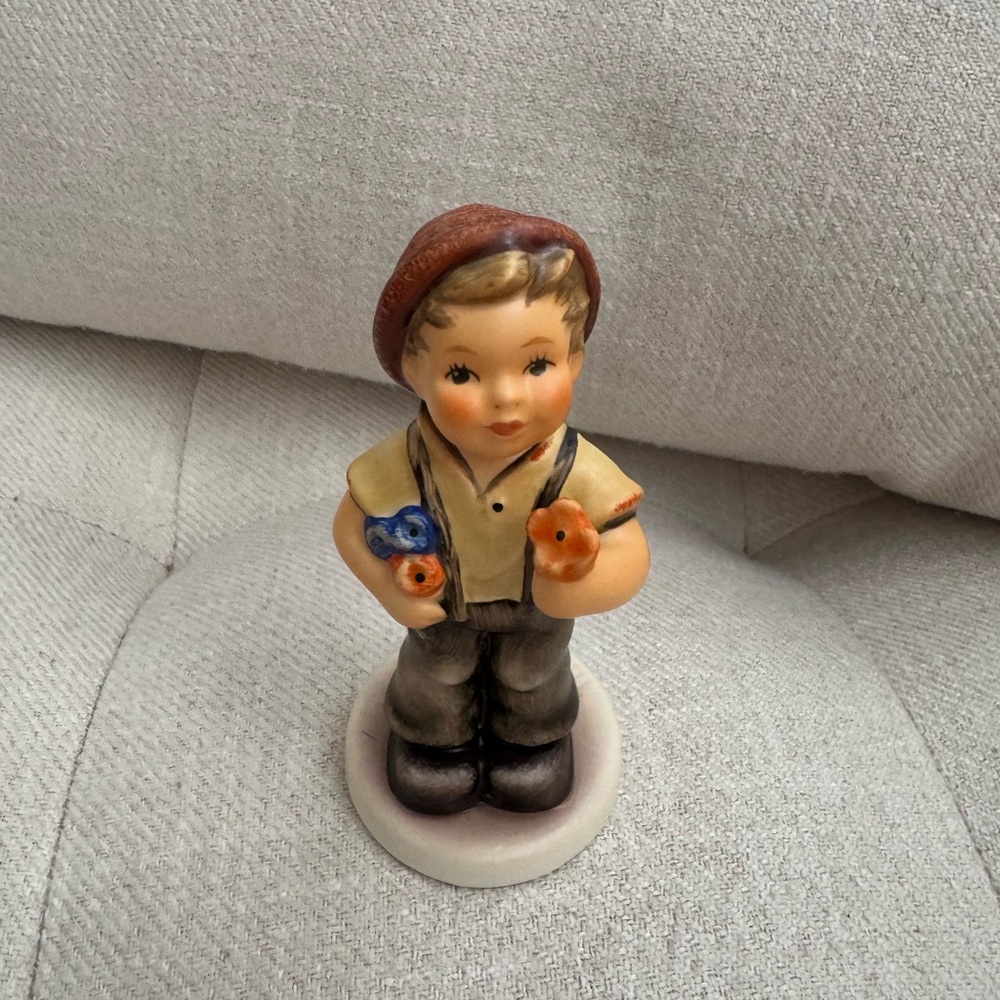 Charming Boy Figurine with Flowers